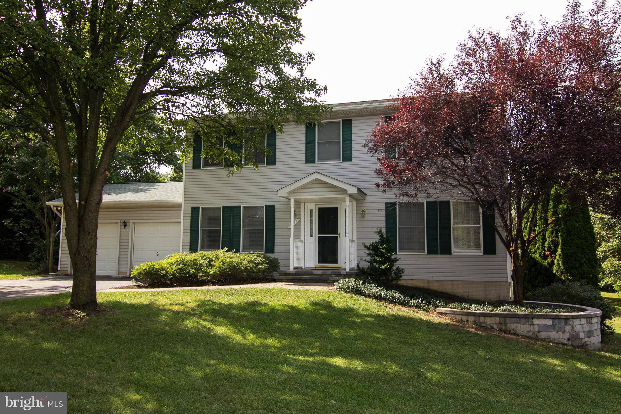 1766 Bloom Road Westminster, MD 21157 - Photo 2 of 29 a front view of a house with a garden
