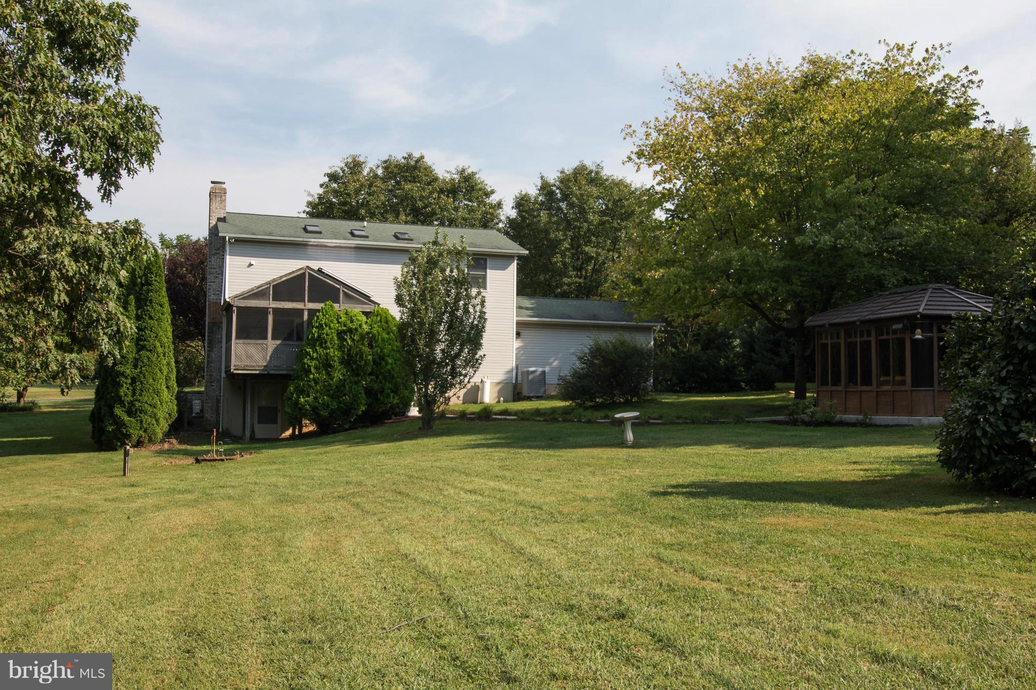 1766 Bloom Road Westminster, MD 21157 - Photo 25 of 29 a view of a house with a yard