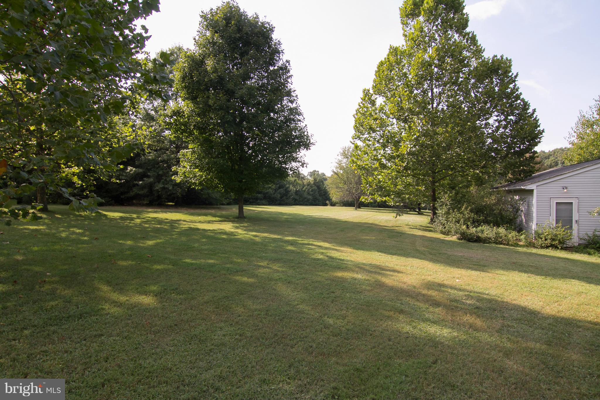 1766 Bloom Road Westminster, MD 21157 - Photo 28 of 29 a view of a field with trees in the background