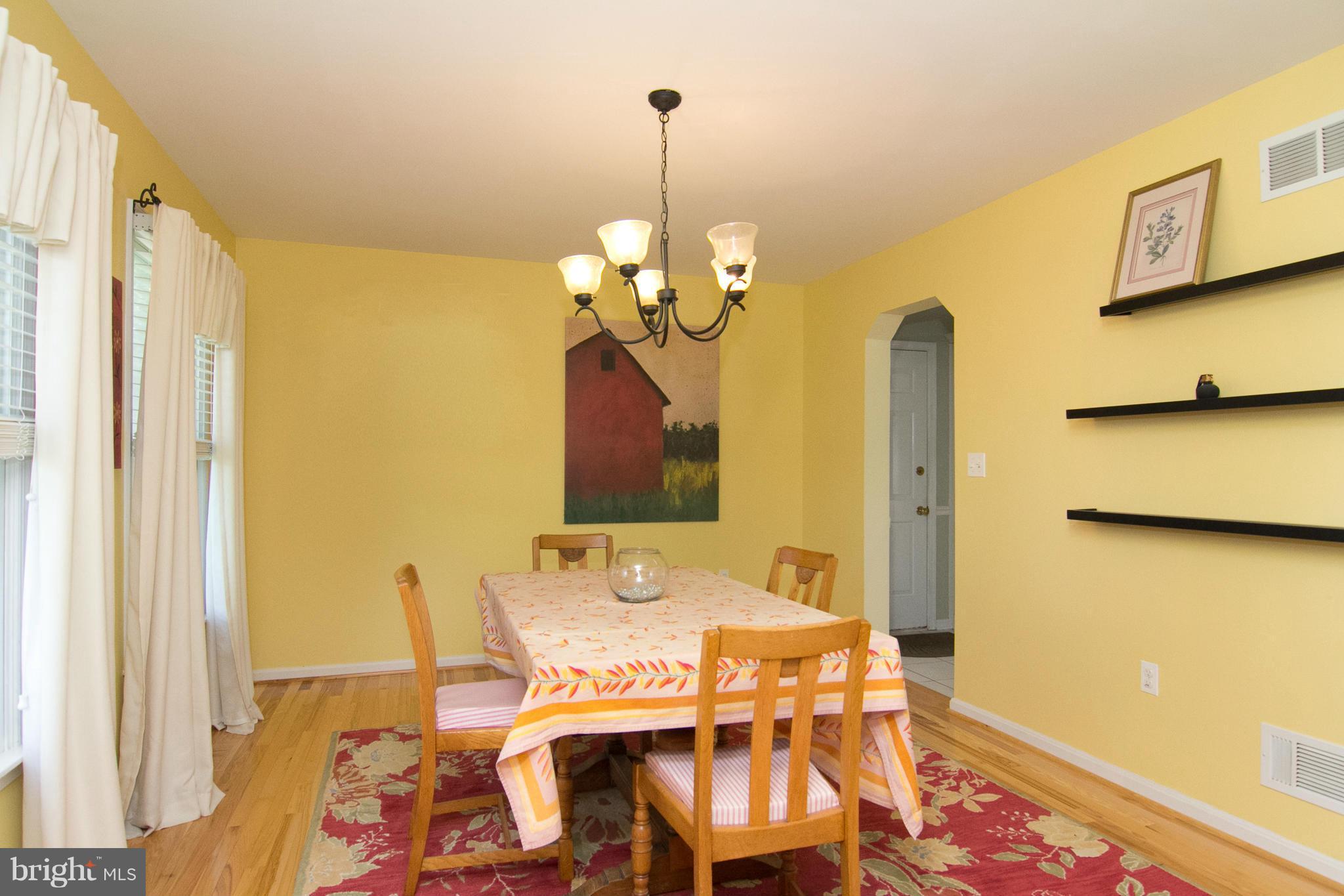 1766 Bloom Road Westminster, MD 21157 - Photo 4 of 29 a view of a dining room with furniture and a chandelier