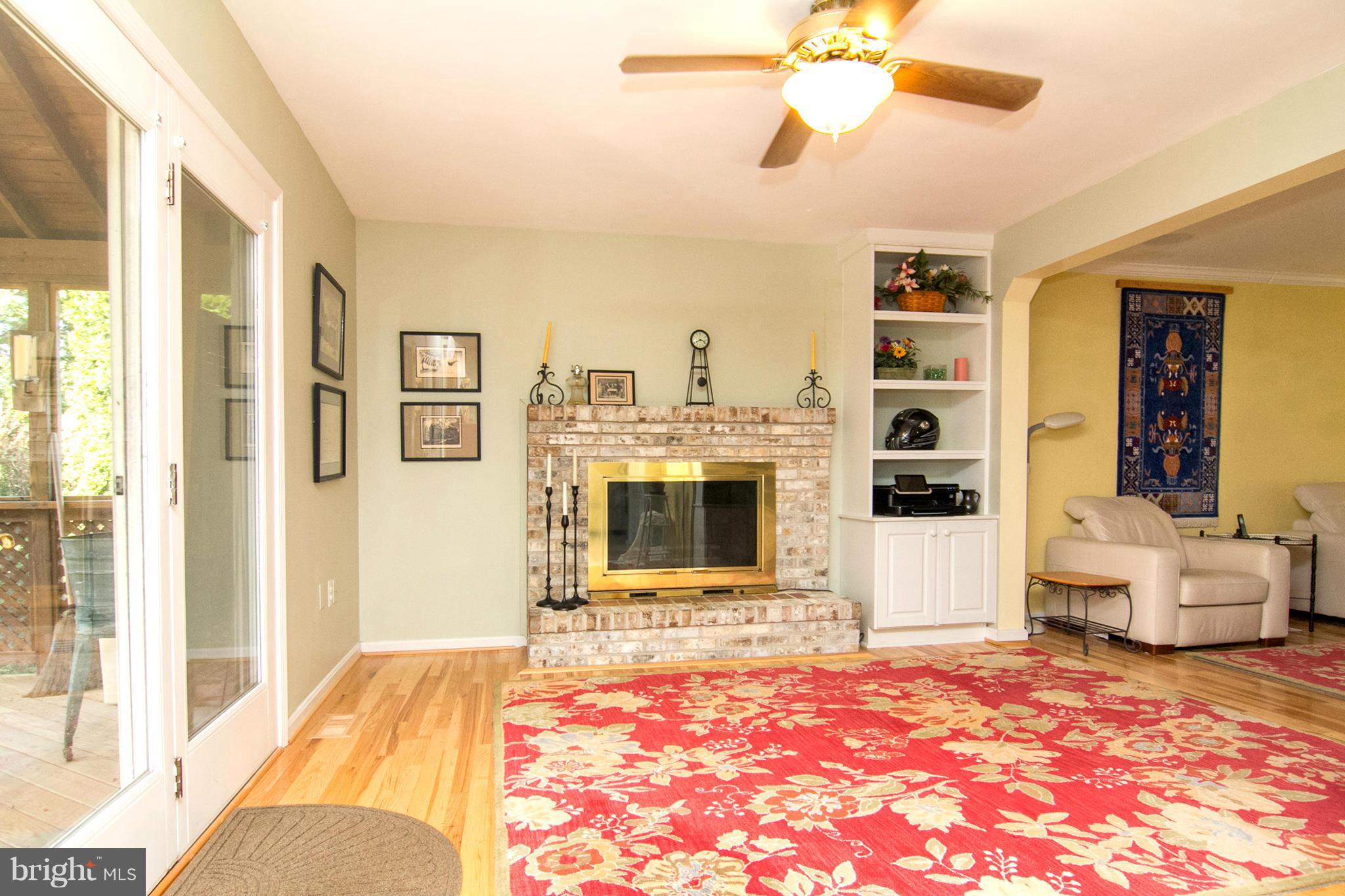 1766 Bloom Road Westminster, MD 21157 - Photo 8 of 29 a living room with furniture a fireplace and a flat screen tv
