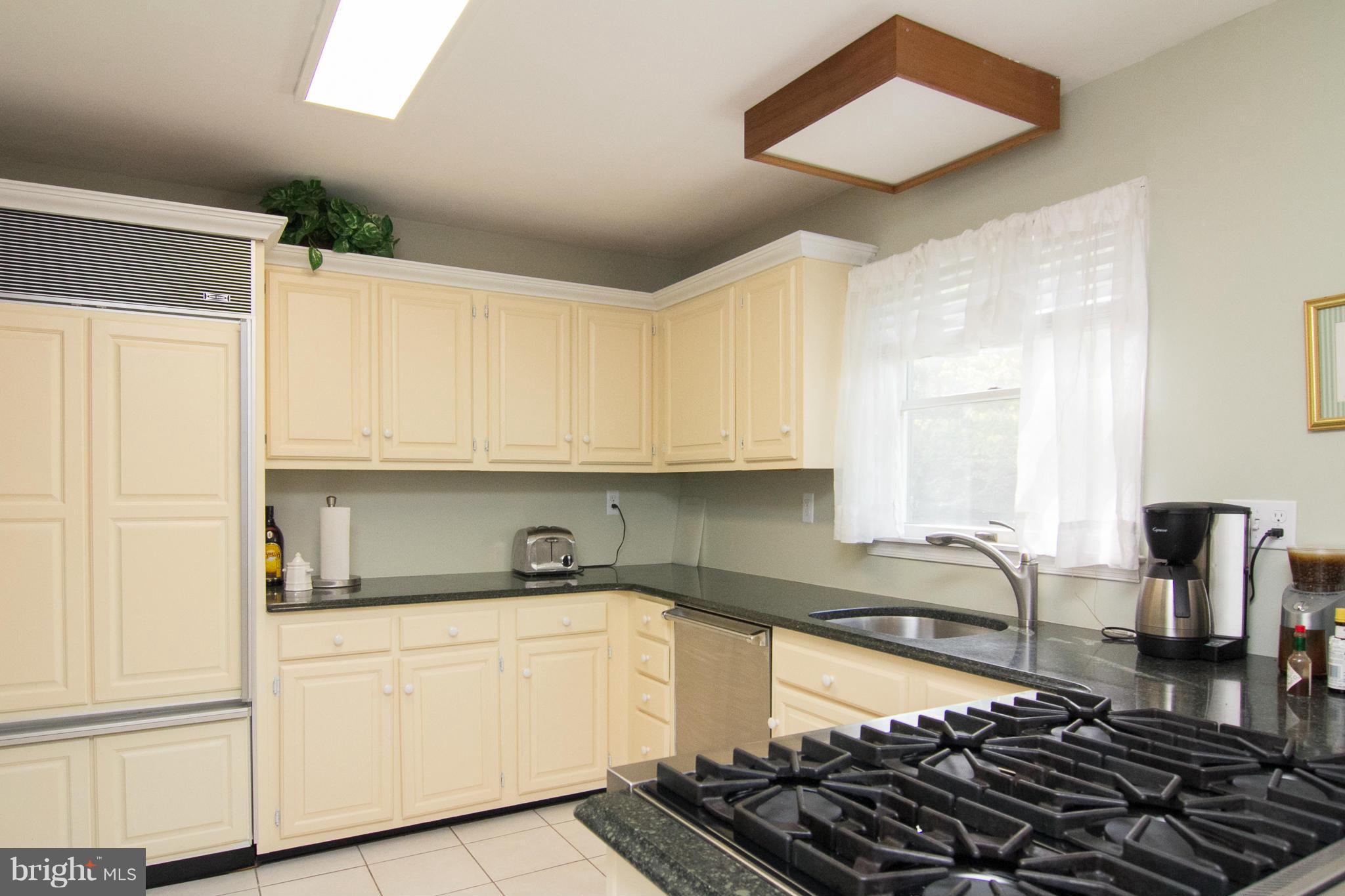 1766 Bloom Road Westminster, MD 21157 - Photo 9 of 29 a kitchen with kitchen island granite countertop a sink and cabinets