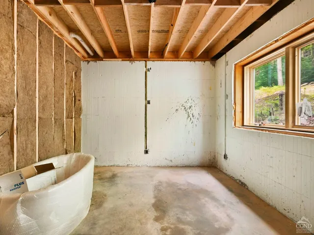 a view of a bathroom with tub and shower