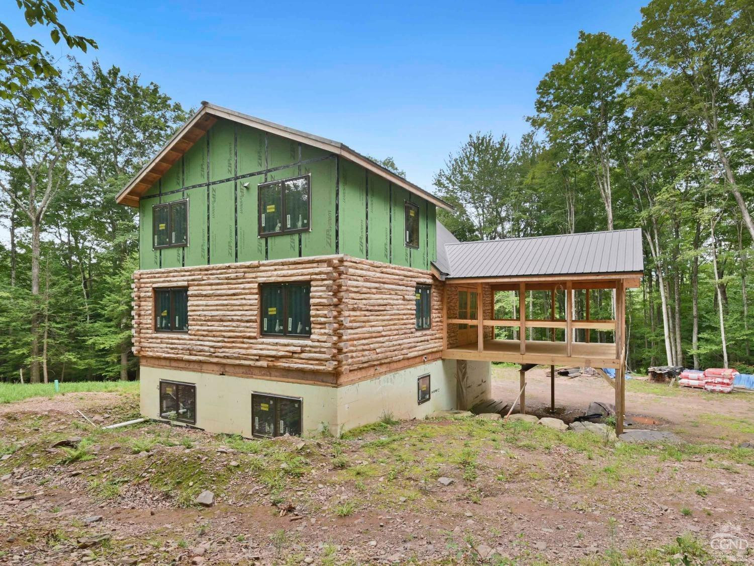 2731 County Route 10 Windham, NY 12496 - Photo 23 of 31 a front view of a house with a yard