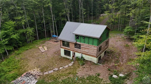 a view of a barbeque grill and a floor to ceiling window