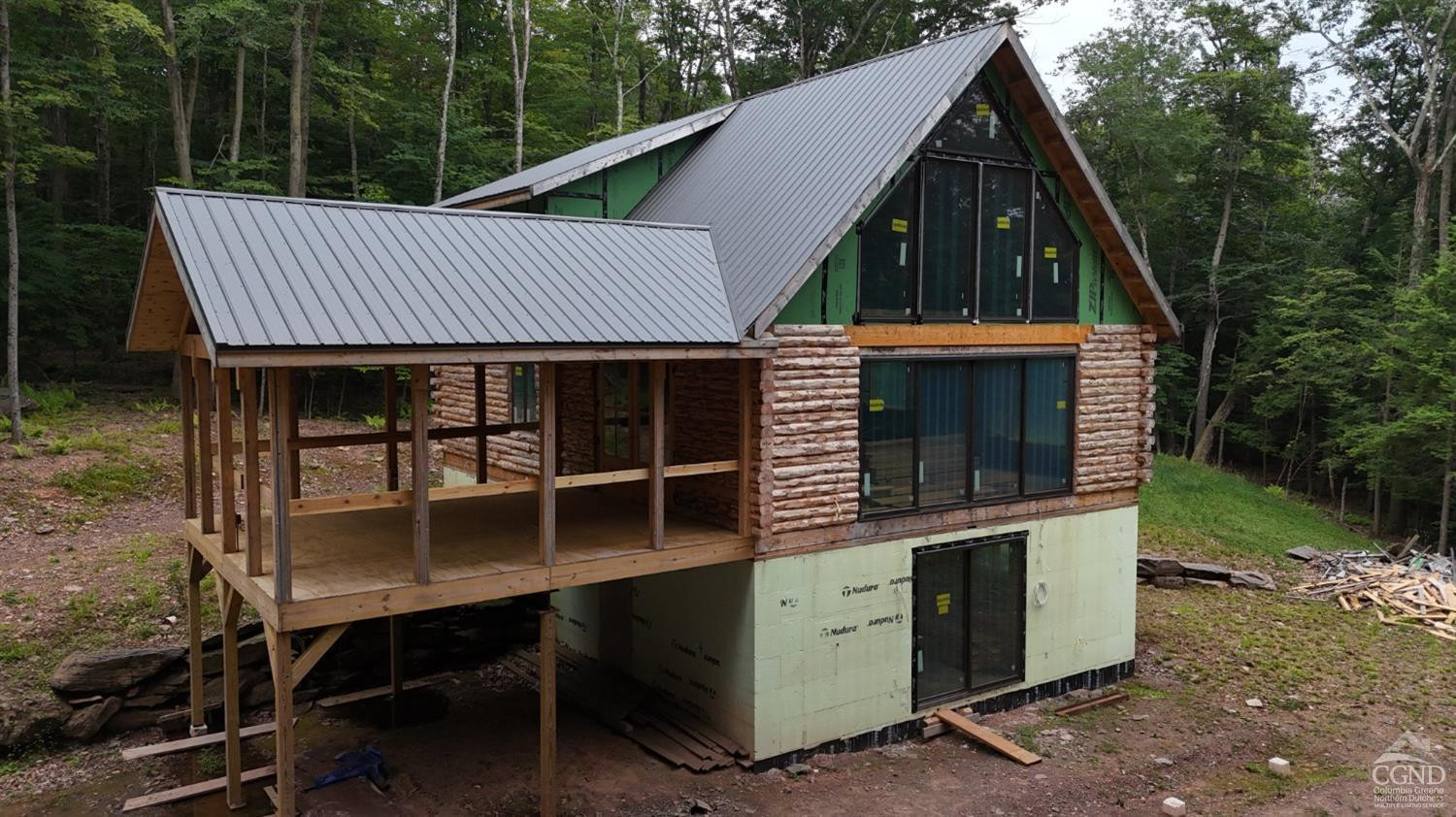 2731 County Route 10 Windham, NY 12496 - Photo 27 of 31 a view of a barbeque grill and a floor to ceiling window