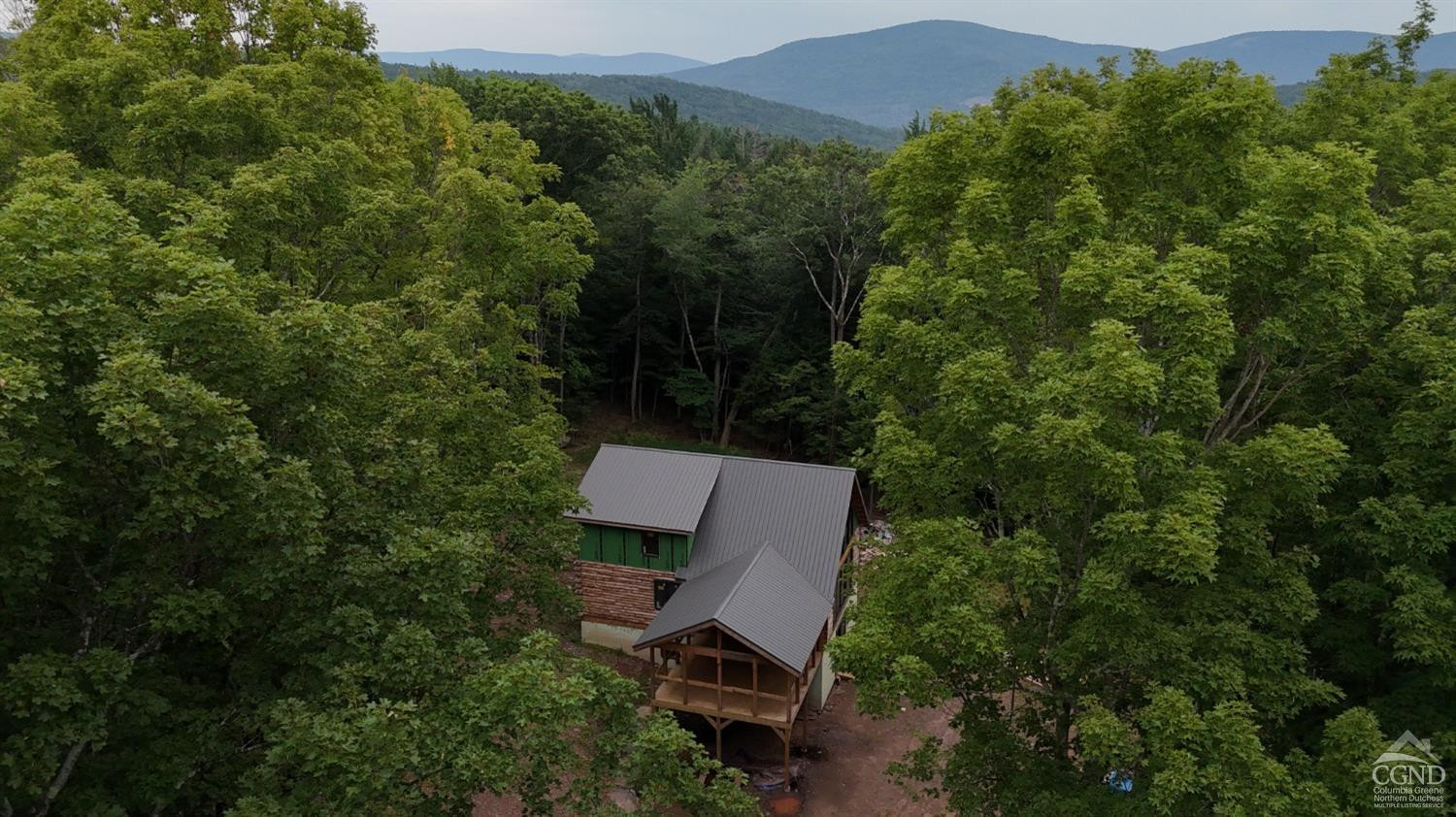 2731 County Route 10 Windham, NY 12496 - Photo 31 of 31 an aerial view of a house with mountain view
