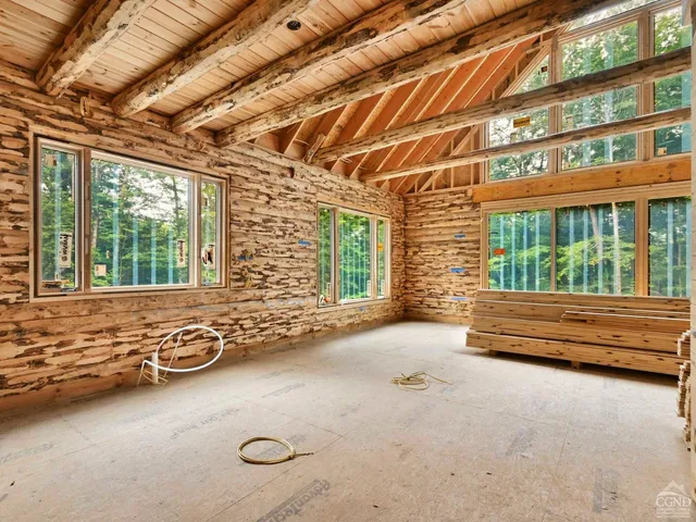 a view of an empty room with windows