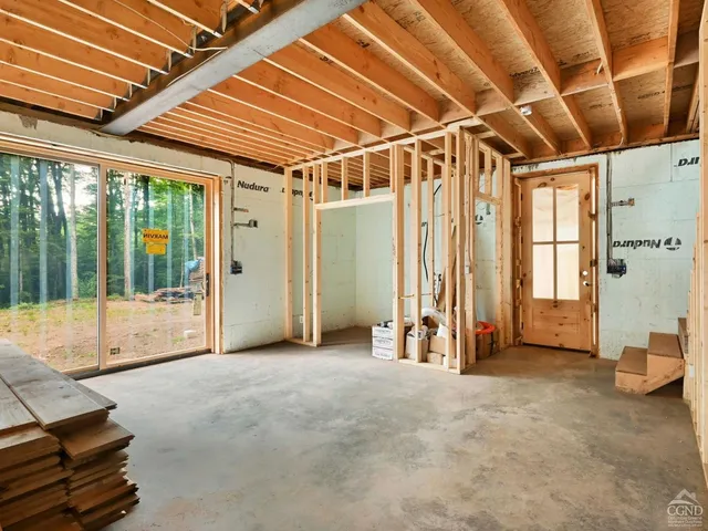 a view of an empty room with a balcony