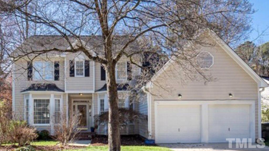 12105 North Exeter Way Raleigh, NC 27613 - Photo 1 of 27 a view of a house with a tree