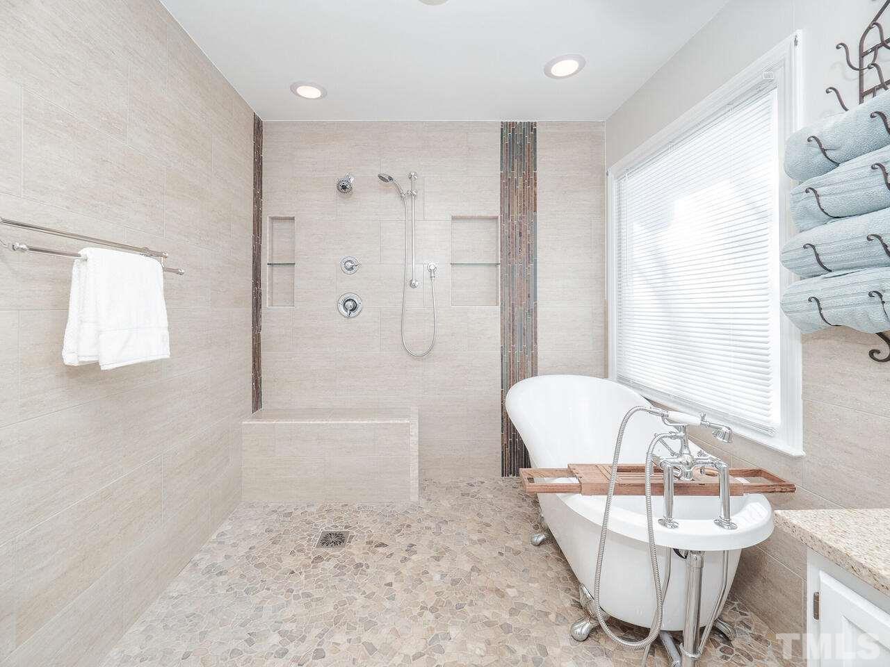 12105 North Exeter Way Raleigh, NC 27613 - Photo 20 of 27 a bathroom with a sink toilet and shower