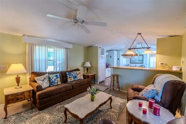 a bed room with a bed and a book shelf