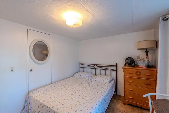 a living room with furniture and a lamp