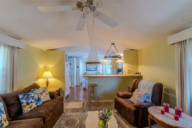 a kitchen with stainless steel appliances granite countertop a sink and a stove