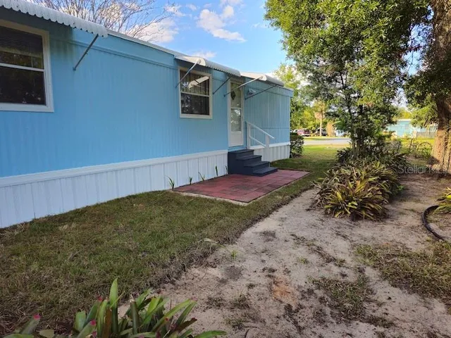 a view of backyard with outdoor space