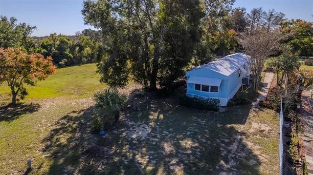 a view of a lake with a house in the background