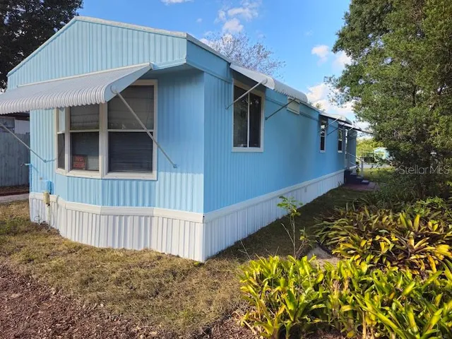 a house with a trees in front of it