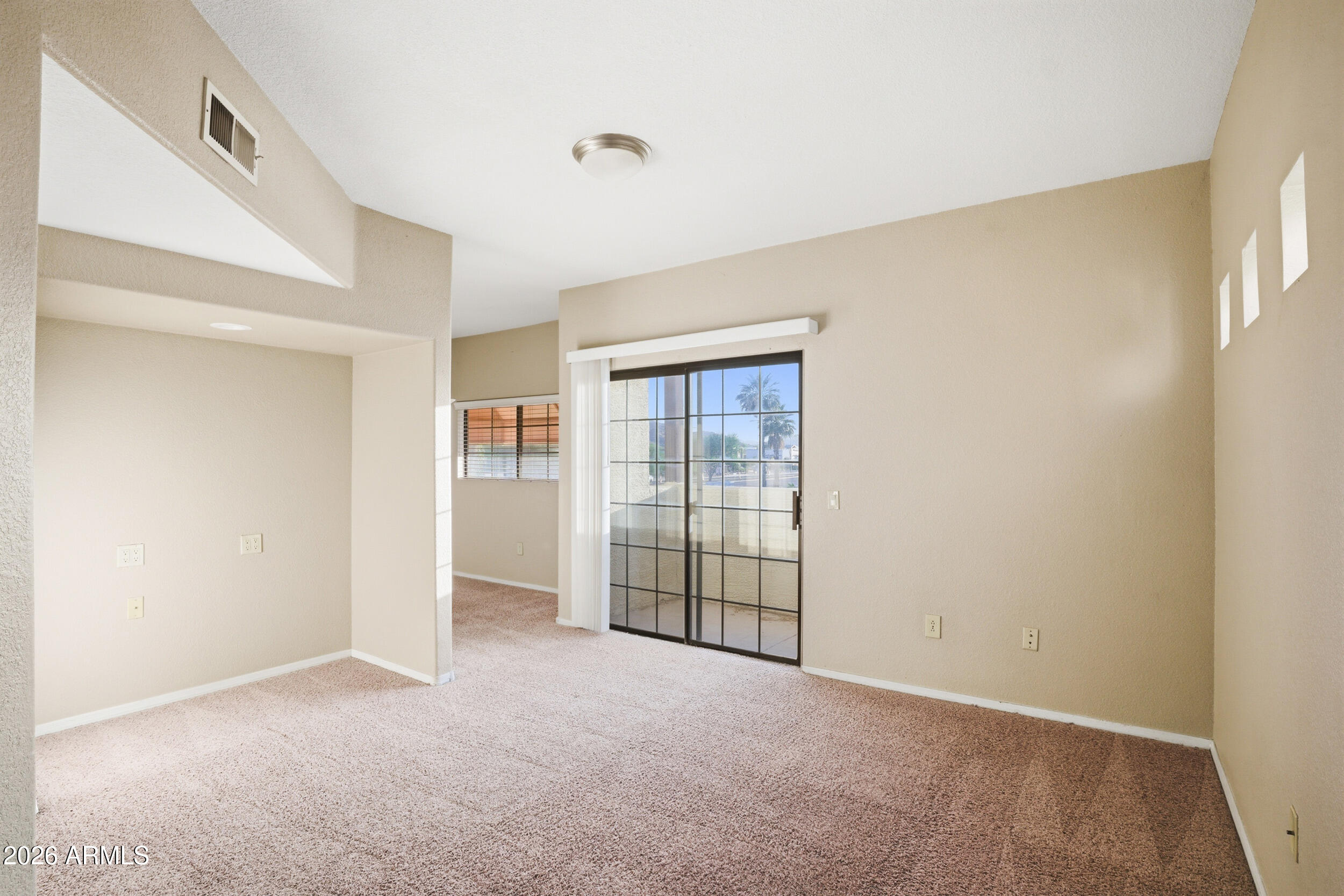 3434 East Baseline Road, Unit 264 Phoenix, AZ 85042 - Photo 4 of 12 a view of an empty room with a window
