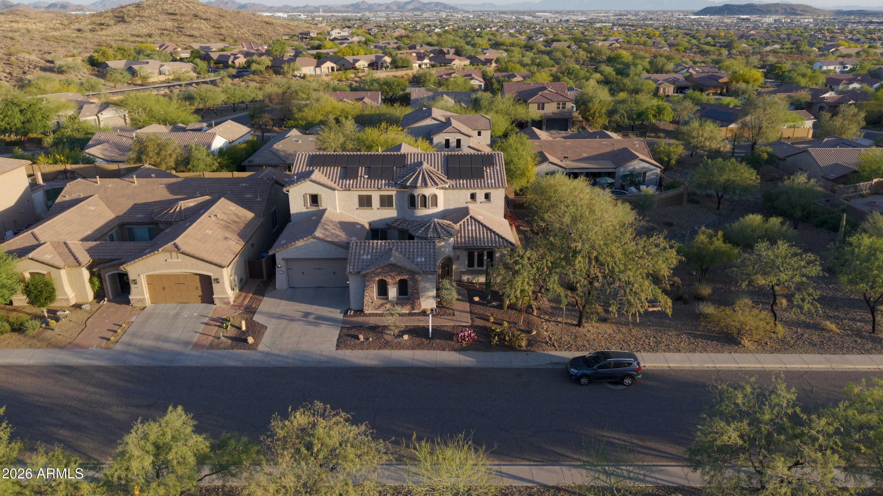 1615 West Red Fox Road Phoenix, AZ 85085 - Photo 2 of 64 an aerial view of residential houses with outdoor space and trees
