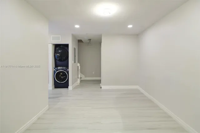 a view of a storage & utility room with a sink
