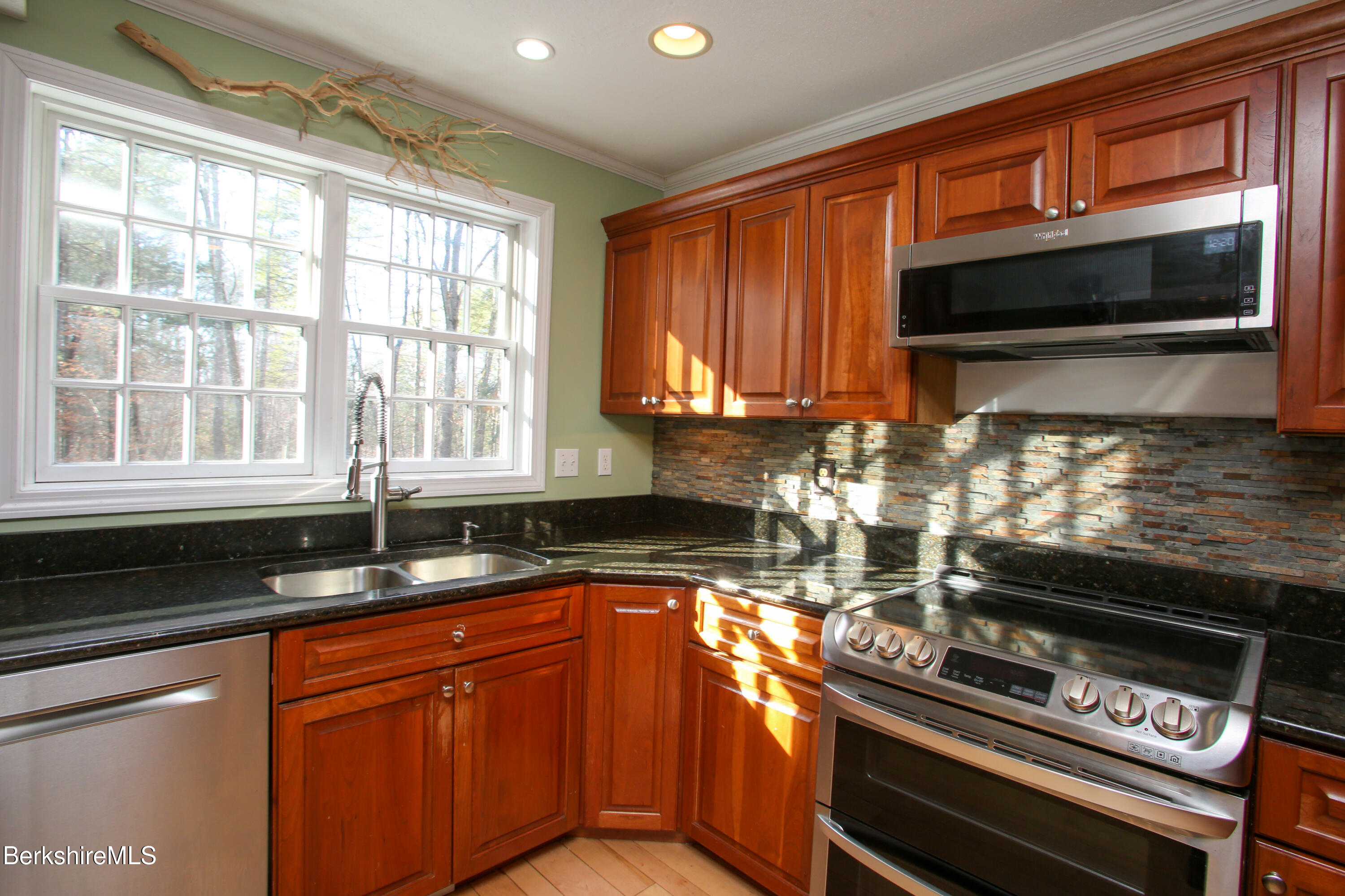 751 Park Hill Road Northampton, MA 01062 - Photo 9 of 45 a kitchen with stainless steel appliances a stove sink and cabinets