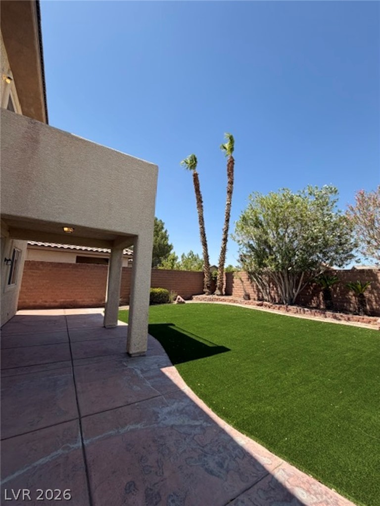 3862 Landing Ridge Place Las Vegas, NV 89135 - Photo 24 of 26 A well-maintained yard offers a private retreat with artificial turf and a covered patio.