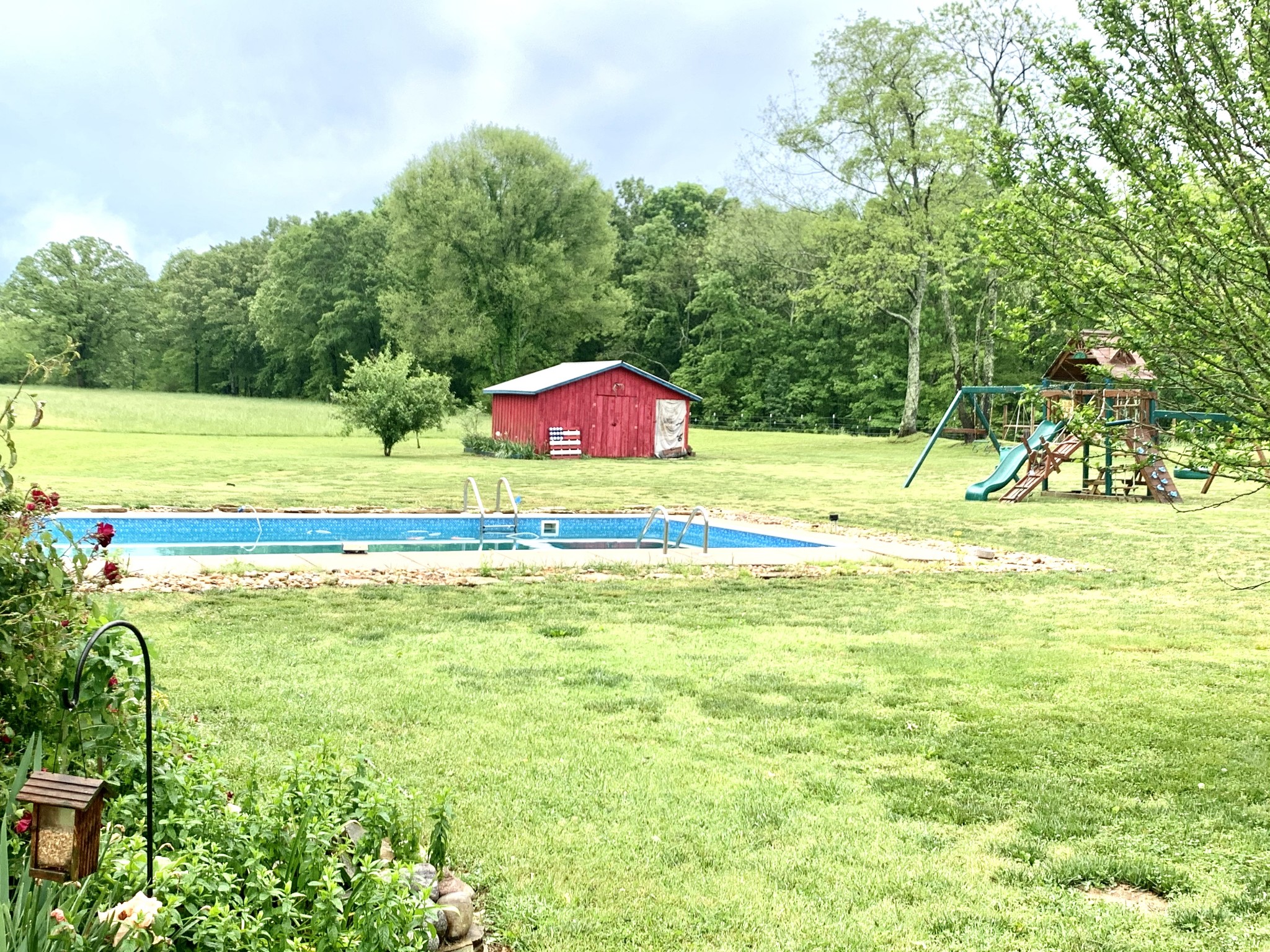 33 Waterloo Road Lawrenceburg, TN 38464 - Photo 8 of 46 a view of a swimming pool and a yard
