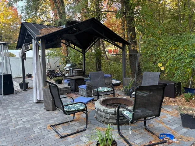 a backyard of a house with outdoor seating