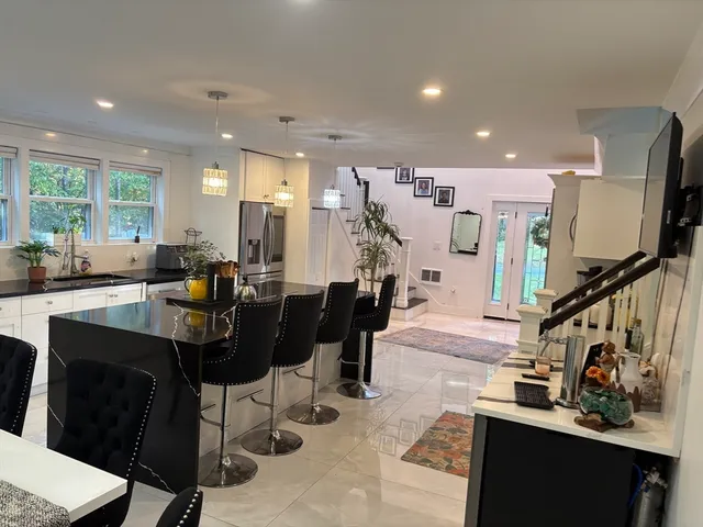 a view of a living room and dining room
