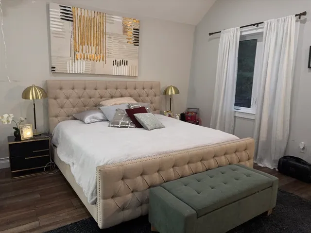 a bedroom with a bed and a couch