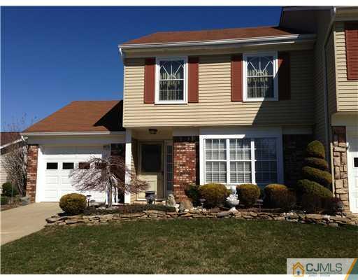 a view of a house with backyard and porch