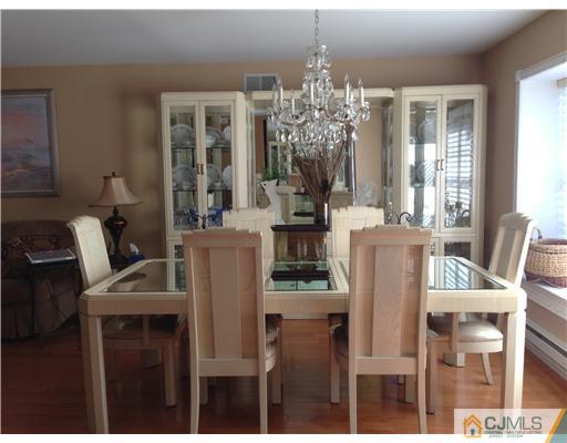 462 A Delair Road Monroe Township, NJ 08831 - Photo 3 of 10 a view of a dining room with furniture and chandelier