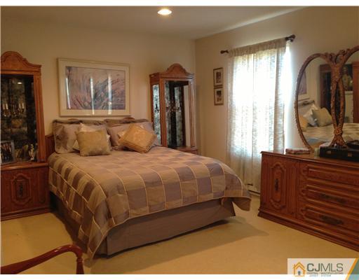 462 A Delair Road Monroe Township, NJ 08831 - Photo 4 of 10 a bedroom with a large bed and windows
