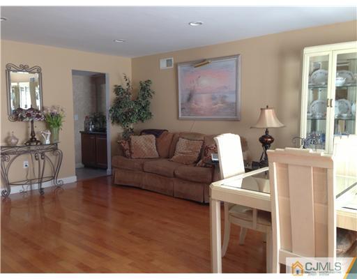 462 A Delair Road Monroe Township, NJ 08831 - Photo 9 of 10 a living room with furniture a window and a wooden floor