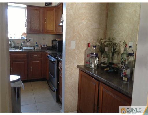 462 A Delair Road Monroe Township, NJ 08831 - Photo 10 of 10 a kitchen with a sink and cabinets
