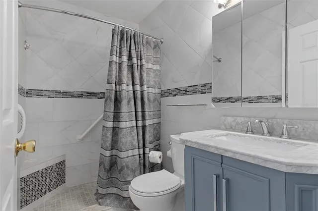 a view of a chandelier fan and closet area