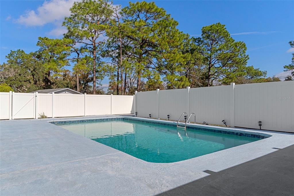 649 Southwest Bend Point Lecanto, FL 34461 - Photo 44 of 50 a backyard of a house with a yard and outdoor seating