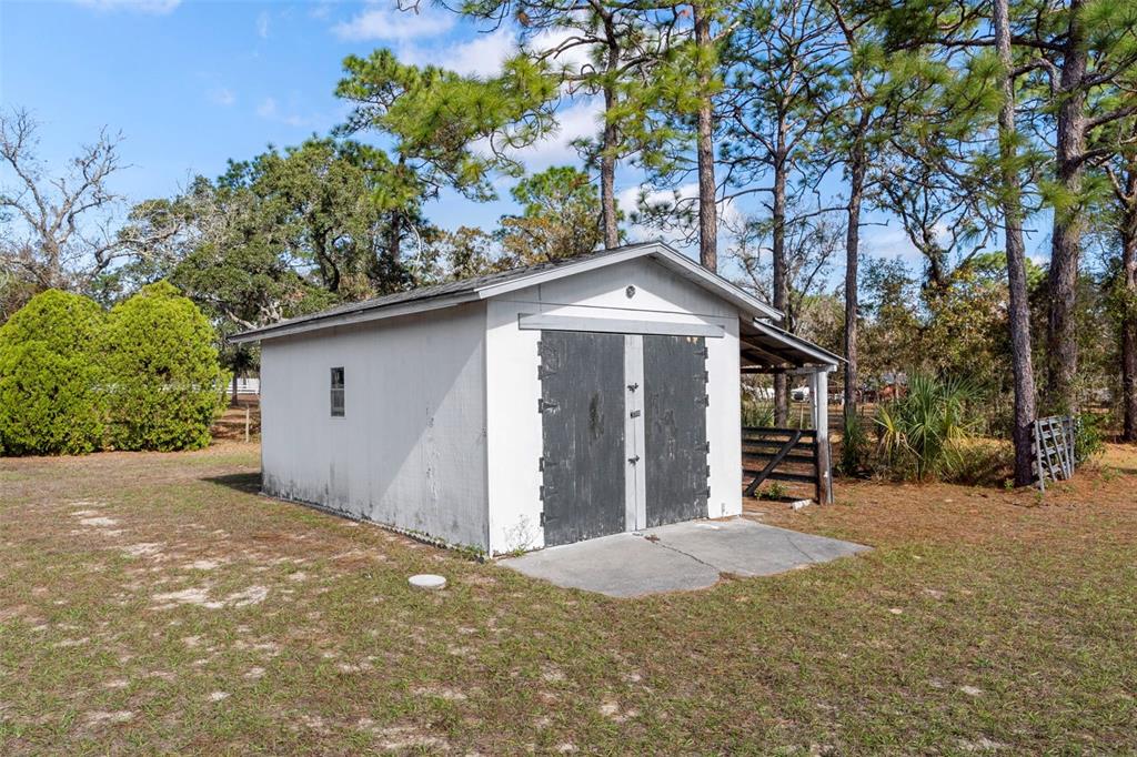 649 Southwest Bend Point Lecanto, FL 34461 - Photo 45 of 50 a front view of a house with a yard and garage