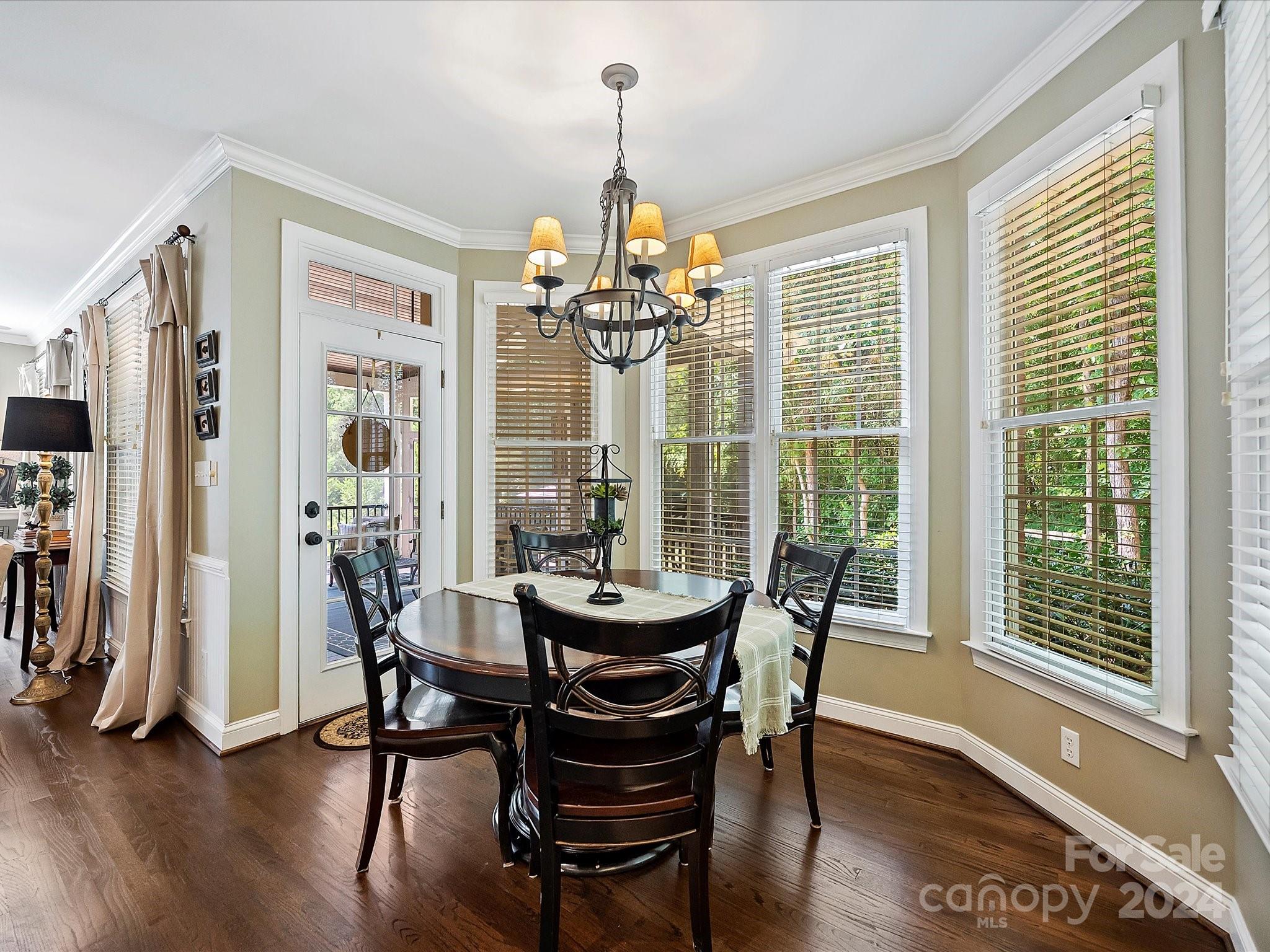 10309 Riesling Court Charlotte, NC 28277 - Photo 19 of 44 a view of a dining room with furniture wooden floor and chandelier