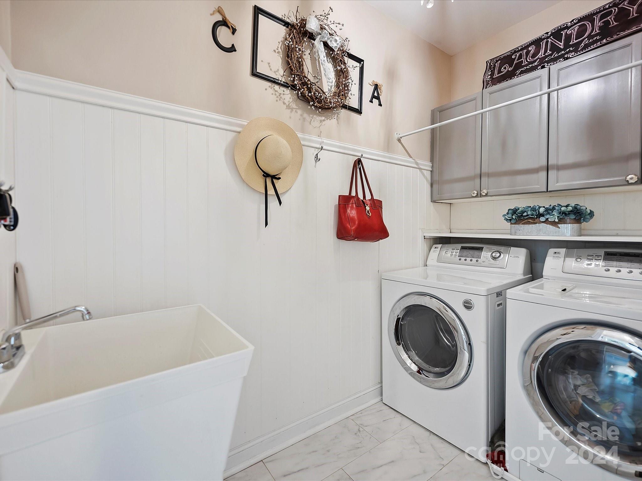 10309 Riesling Court Charlotte, NC 28277 - Photo 23 of 44 a utility room with cabinets dryer and washer