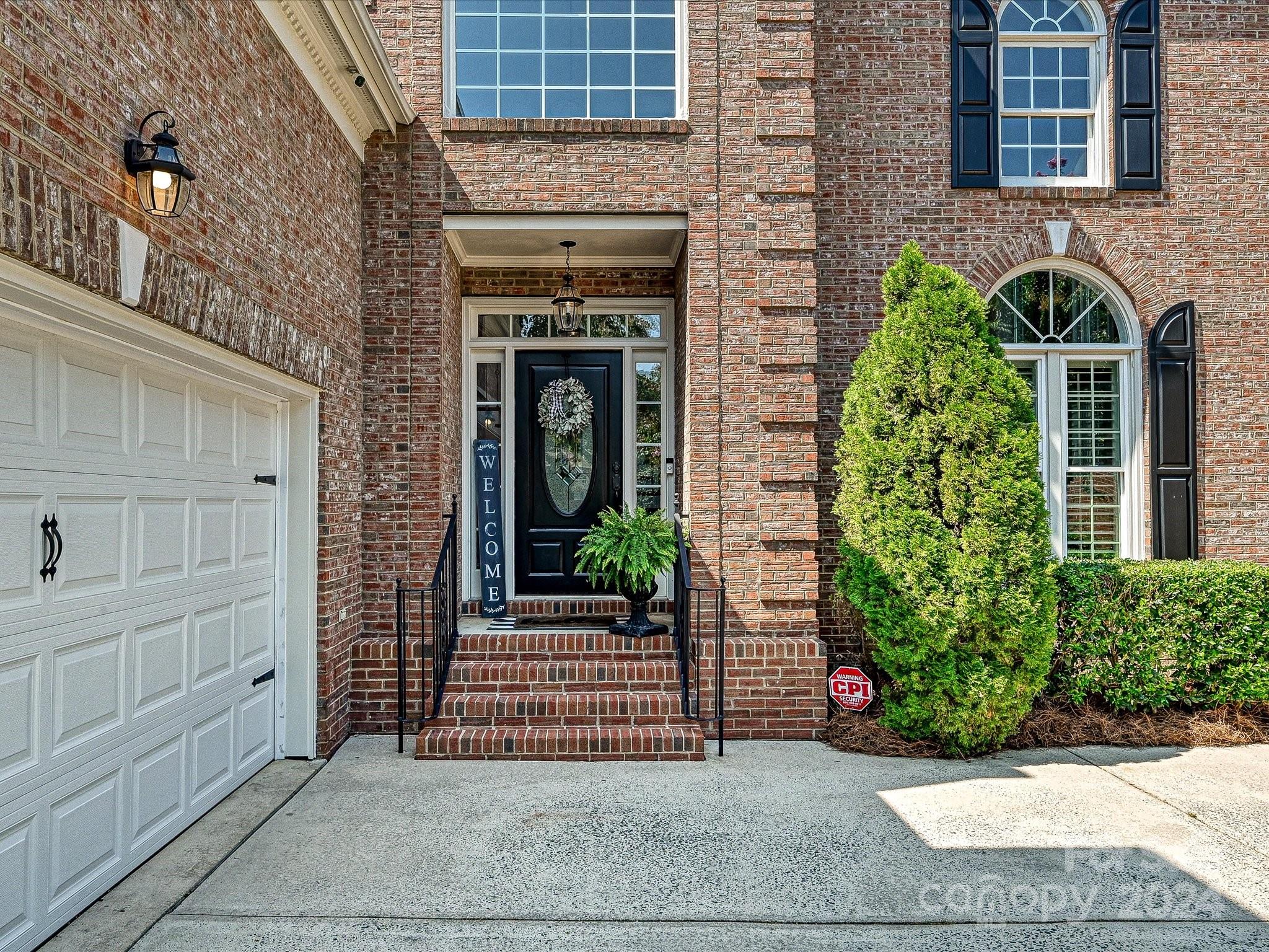 10309 Riesling Court Charlotte, NC 28277 - Photo 3 of 44 a front view of a house with garden
