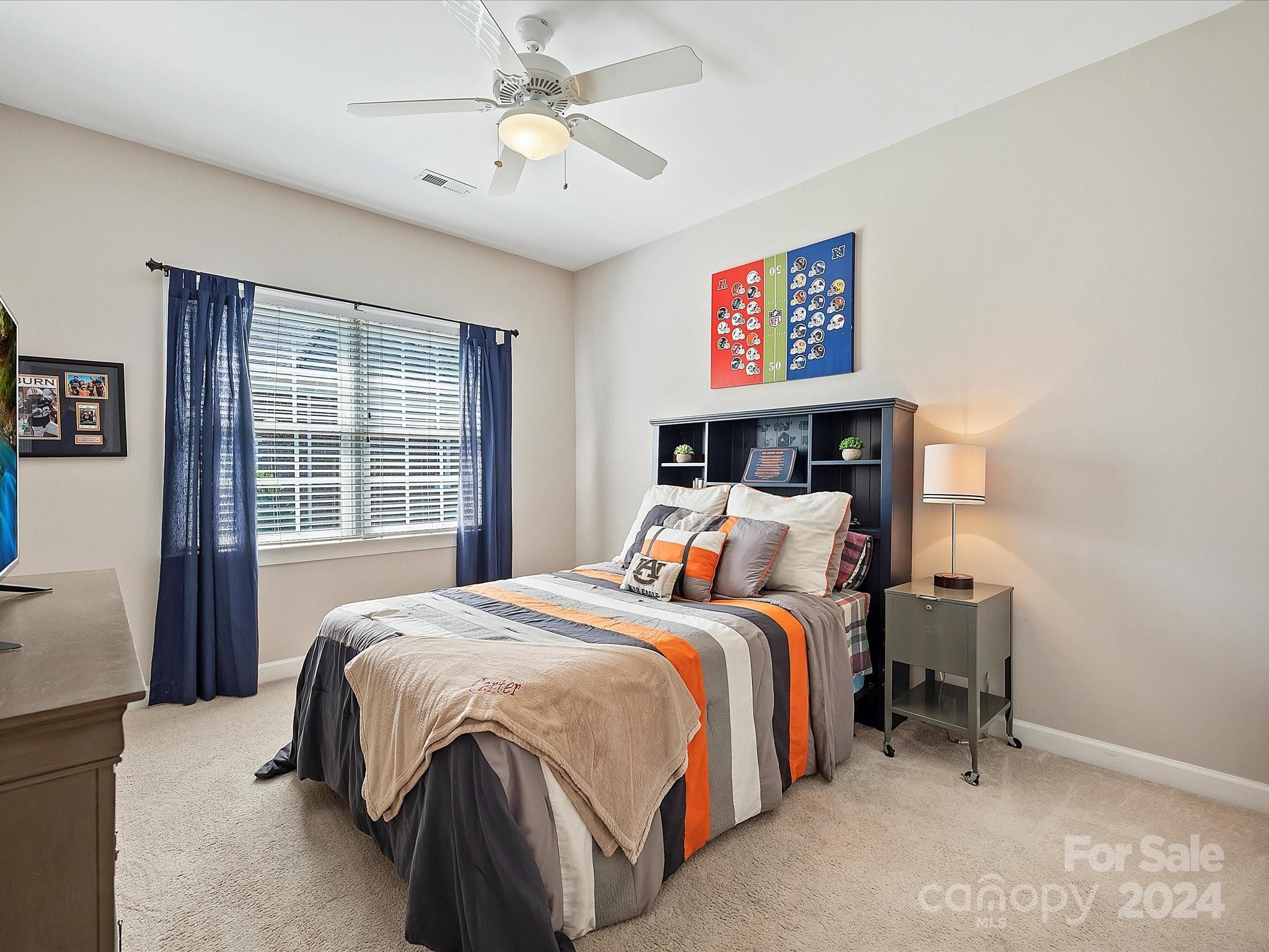 10309 Riesling Court Charlotte, NC 28277 - Photo 33 of 44 a bed sitting in a bedroom next to a window