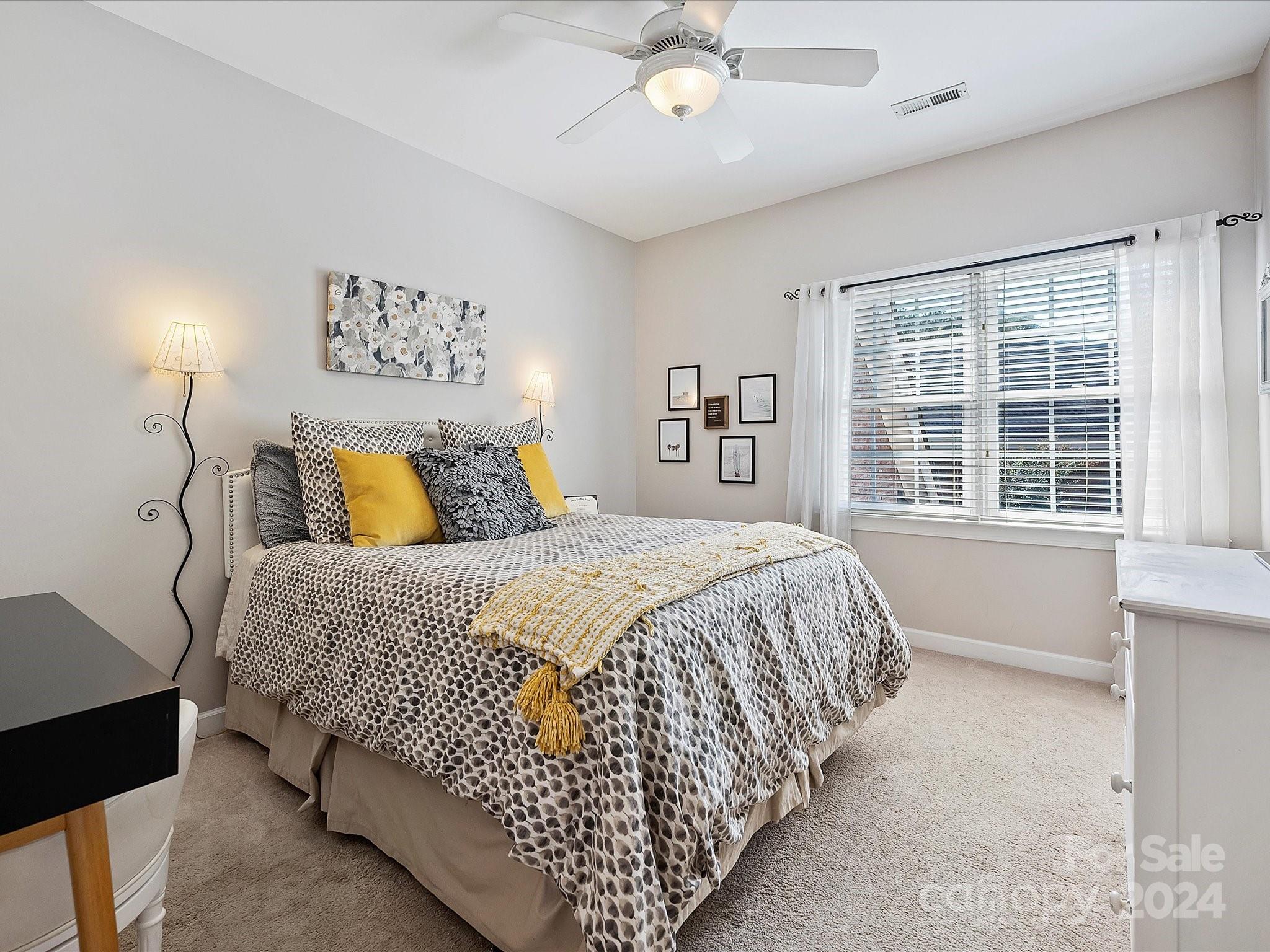 10309 Riesling Court Charlotte, NC 28277 - Photo 34 of 44 a bedroom with a large bed and a window
