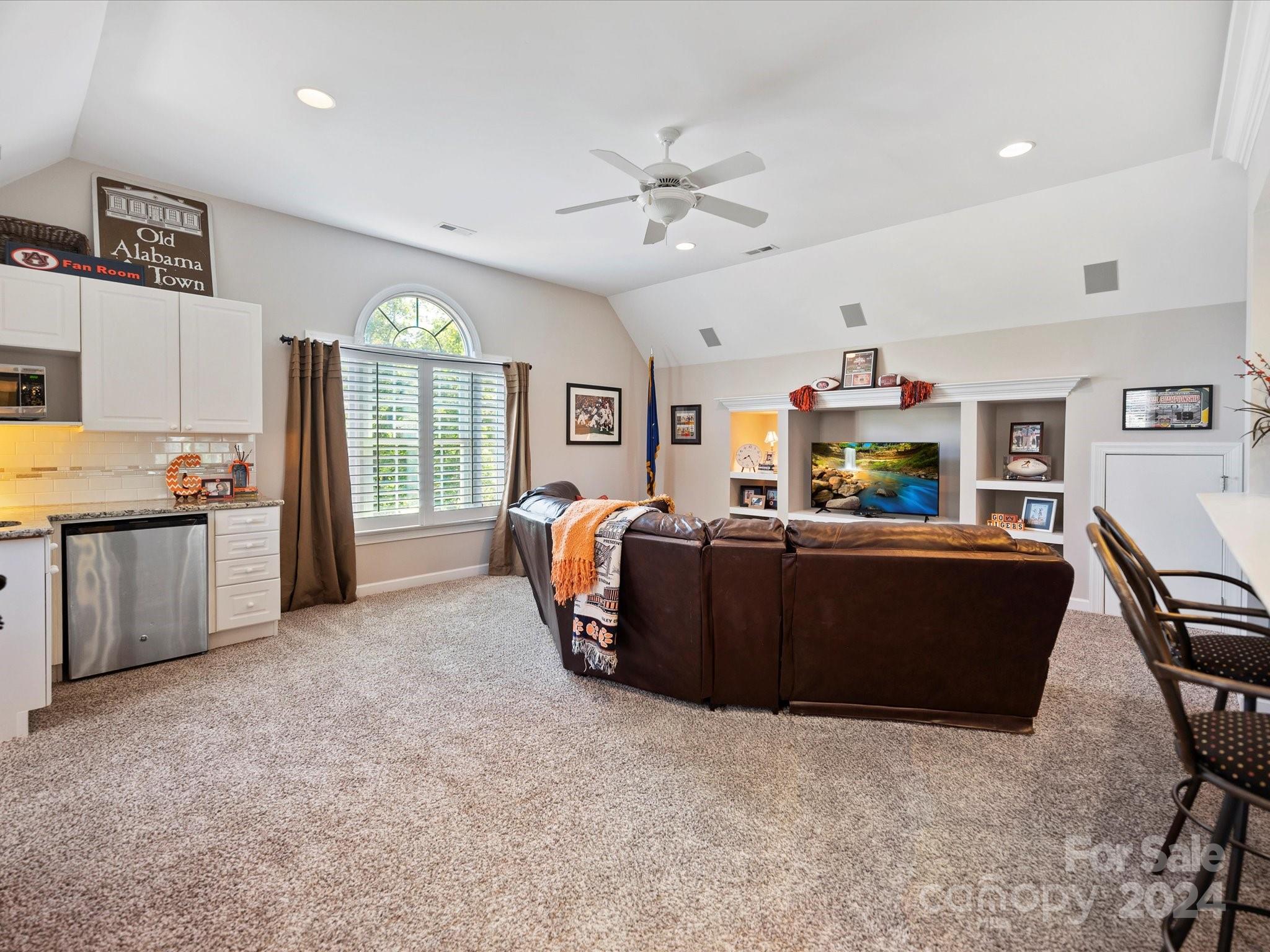 10309 Riesling Court Charlotte, NC 28277 - Photo 36 of 44 a living room with furniture and a flat screen tv