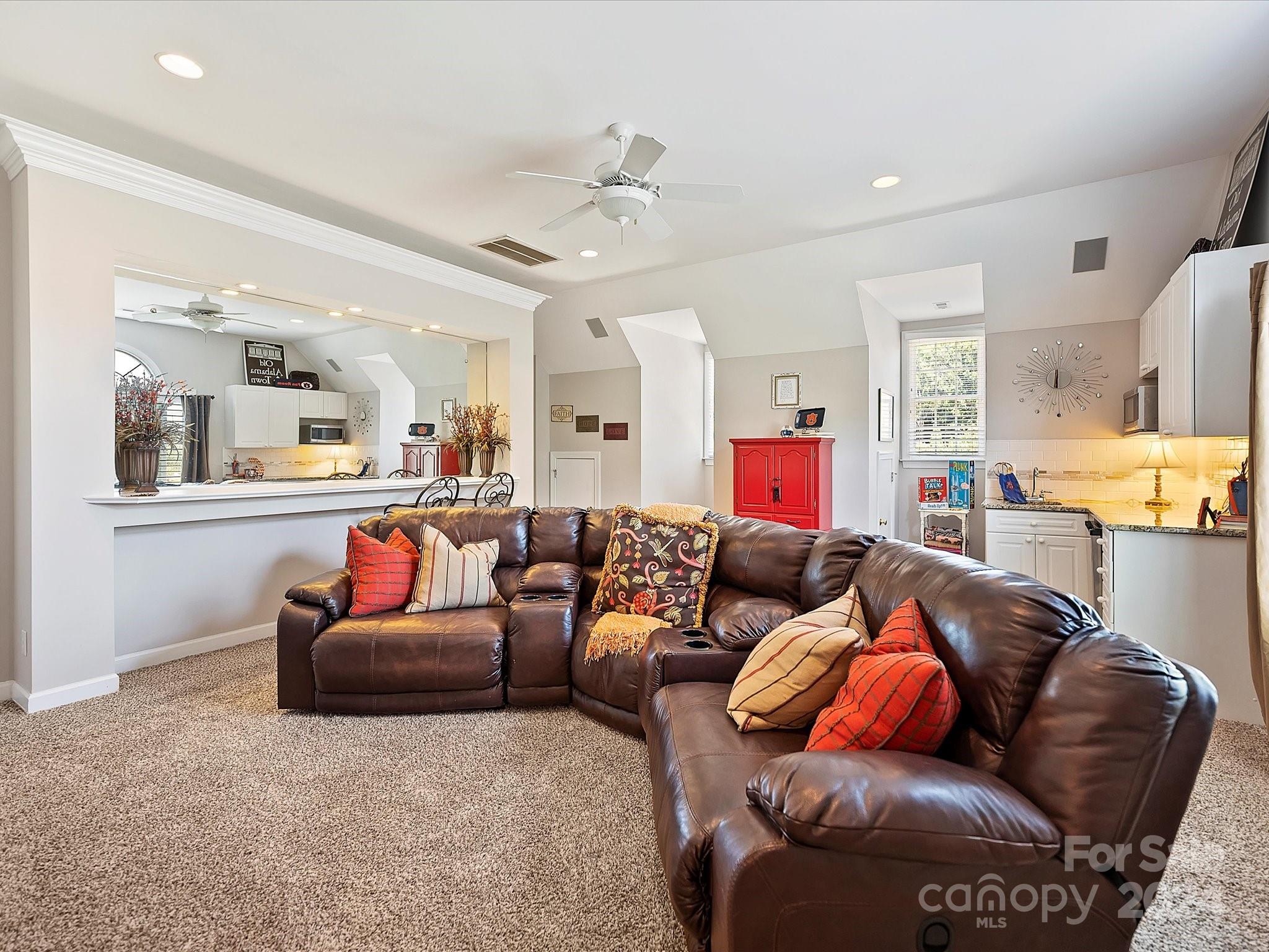10309 Riesling Court Charlotte, NC 28277 - Photo 37 of 44 a living room with furniture and a chandelier