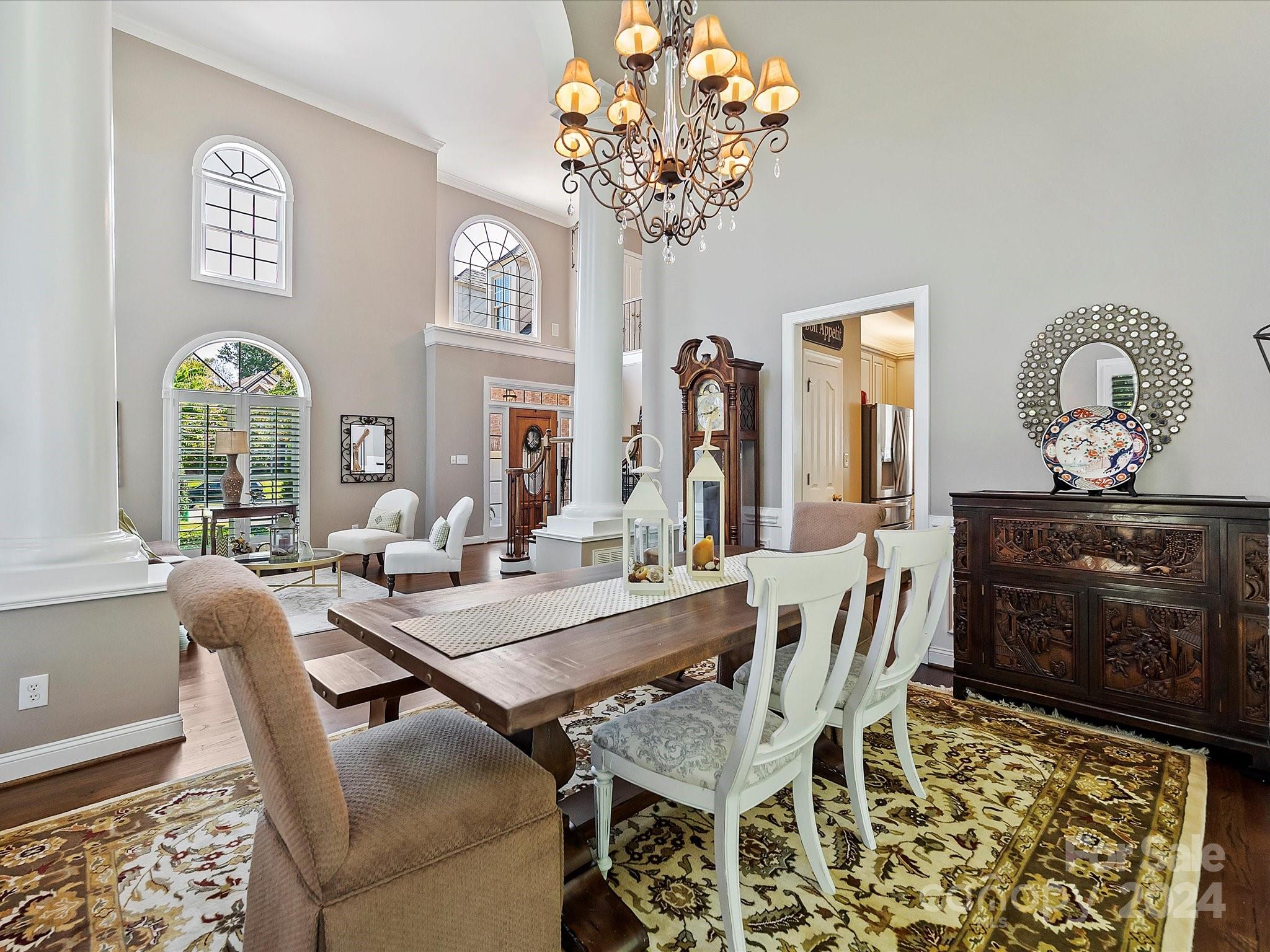10309 Riesling Court Charlotte, NC 28277 - Photo 9 of 44 a view of a dining room with furniture and chandelier