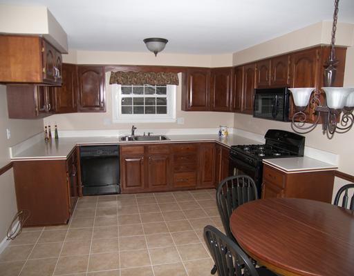 8219 Post Road Allison Park, PA 15101 - Photo 2 of 12 Kitchen. Cherry cabinets and corian counters plus new ceramic flooring and fresh neutral paint enchance this lovely eat-in kitchen!
