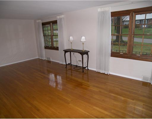8219 Post Road Allison Park, PA 15101 - Photo 3 of 12 Living Room. The 13 x 22 living room boasts hardwood flooring and lots of natural lighting.