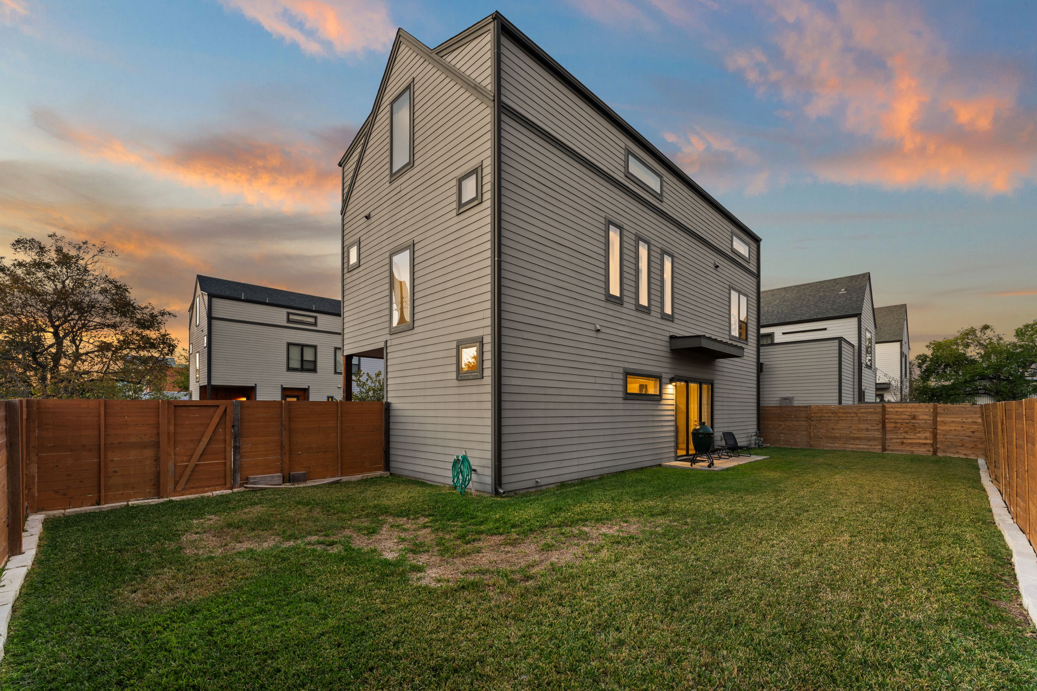 1116 Stobaugh Street, Unit A Austin, TX 78757 - Photo 33 of 37 a view of backyard of house with wooden fence