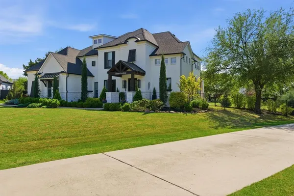 a front view of house with yard and green space